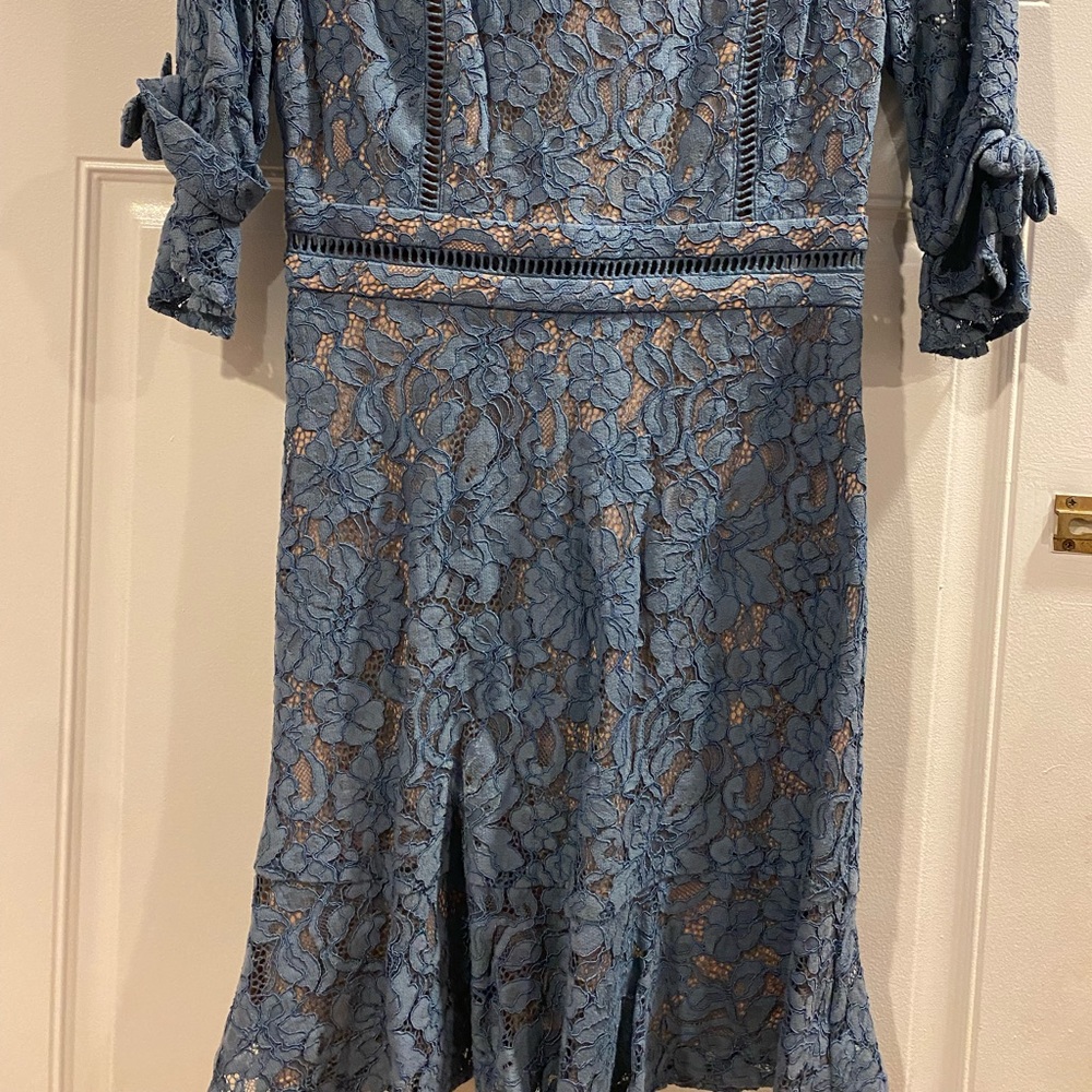 NWOT Light blue women dress. In excellent condition.